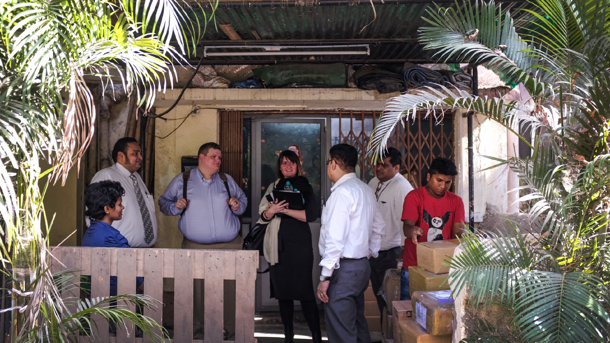 Annette Neu conducting field research with a small-business owner in Mumbai